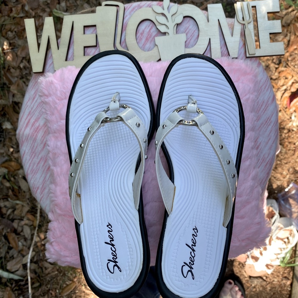 Women’s white Skechers thong, wedge, sandals in a size 6. Worn only once.